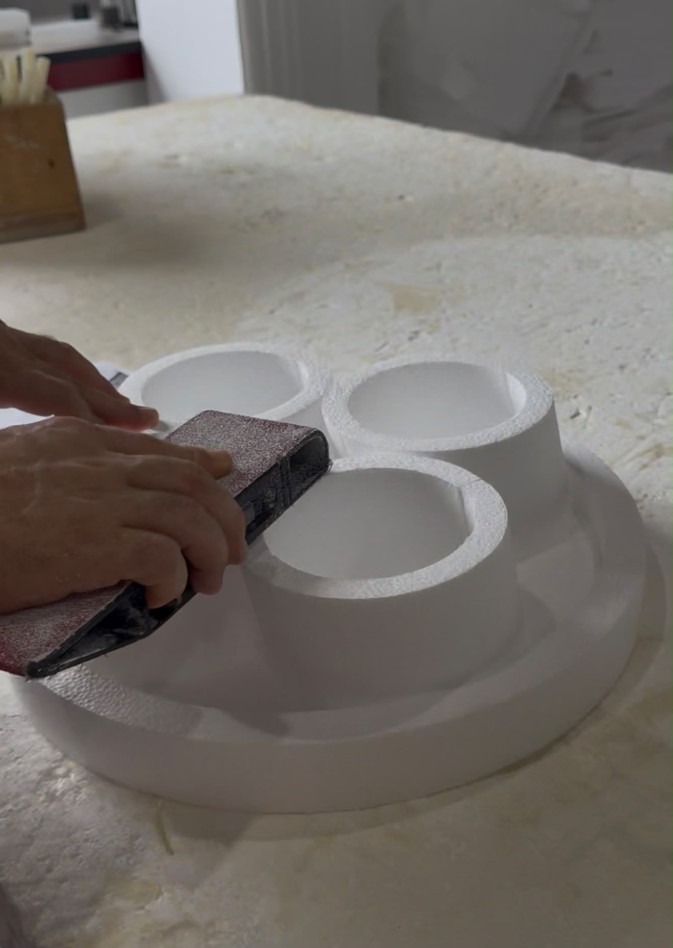 Hand sanding a custom foam piece